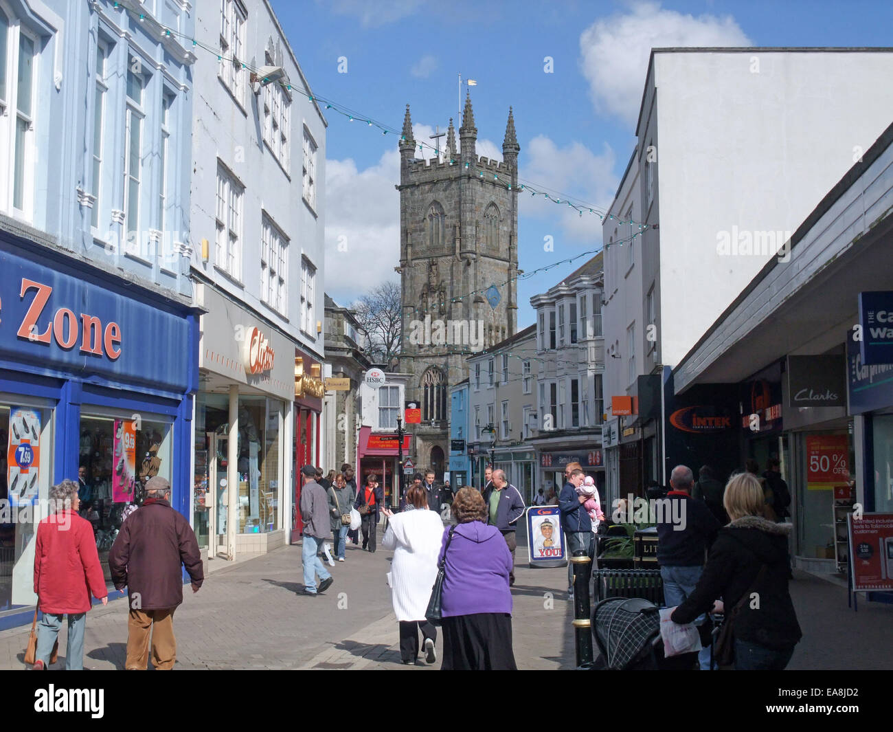 Shoppers in Fore Street with view to Holy Trinity church St Austell Town Centre Restormel Mid