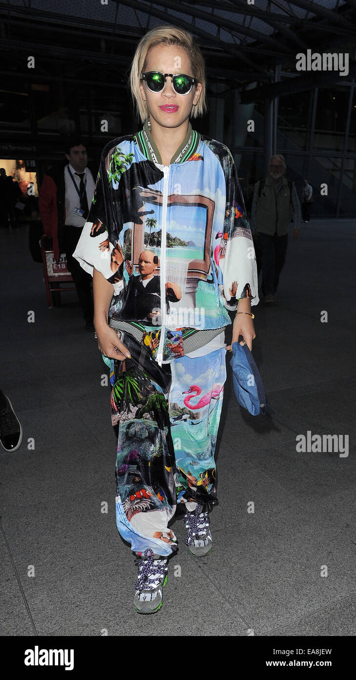 Rita Ora arriving at Heathrow Airport, wearing an outrageous tracksuit