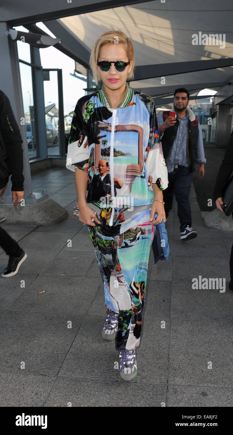 Rita Ora arriving at Heathrow Airport, wearing an outrageous tracksuit