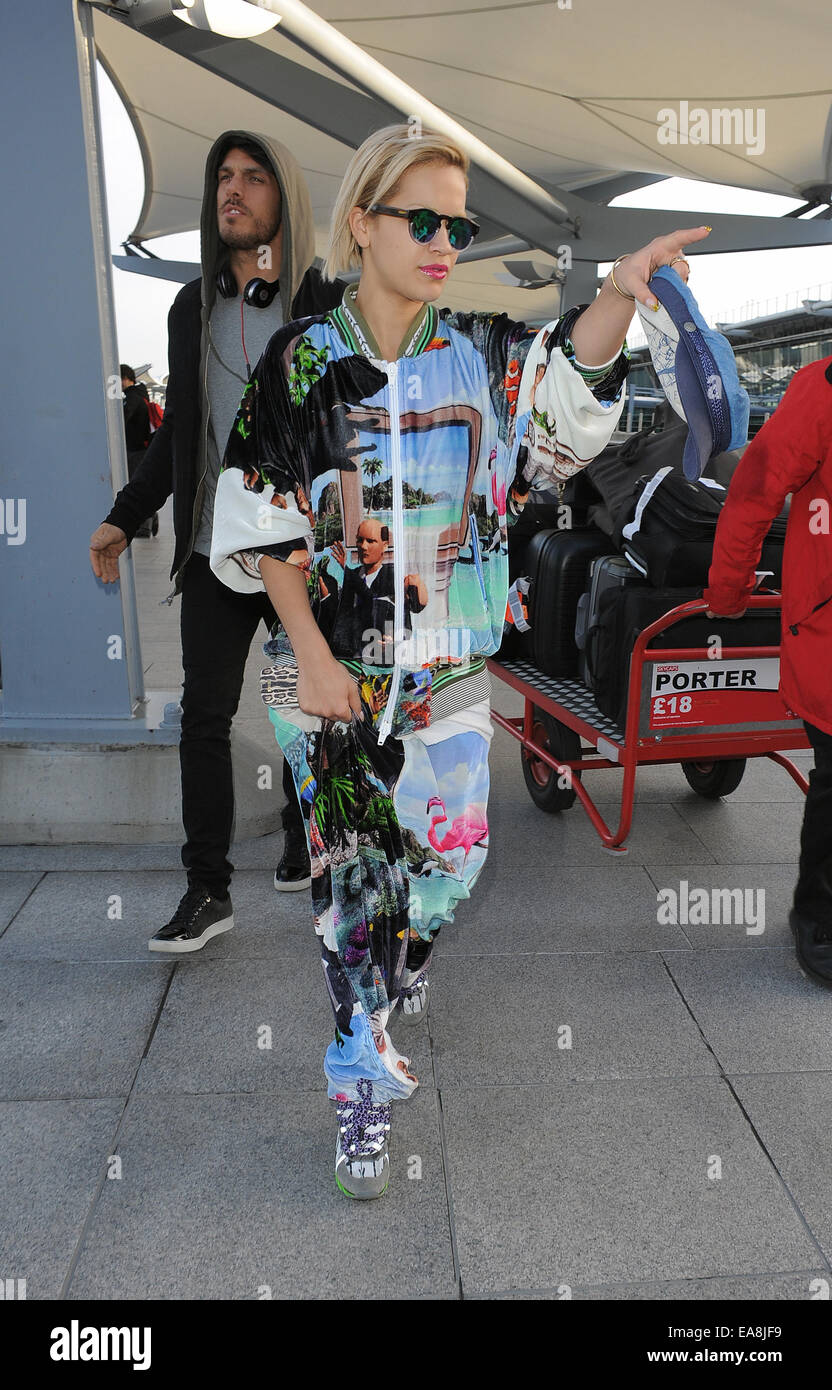 Rita Ora arriving at Heathrow Airport, wearing an outrageous tracksuit