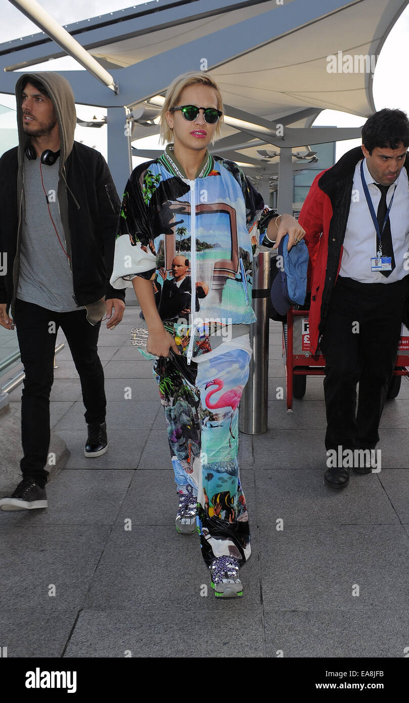 Rita Ora arriving at Heathrow Airport, wearing an outrageous tracksuit