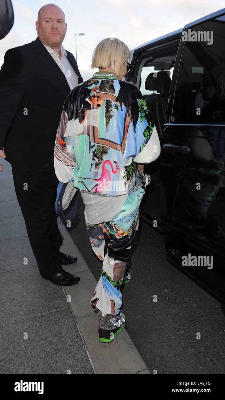 Rita Ora arriving at Heathrow Airport, wearing an outrageous tracksuit