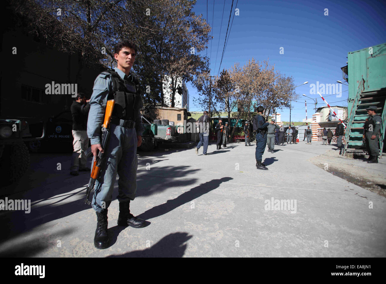Kabul, Afghanistan. 9th Nov, 2014. Policemen stand guard near the Kabul Police Main Office after a blast in Kabul, Afghanistan, Nov. 9, 2014. At least one person was killed and eight others were wounded after a bomb went off in Afghan capital police chief's office on Sunday morning, sources said. Credit:  Ahmad Massoud/Xinhua/Alamy Live News Stock Photo