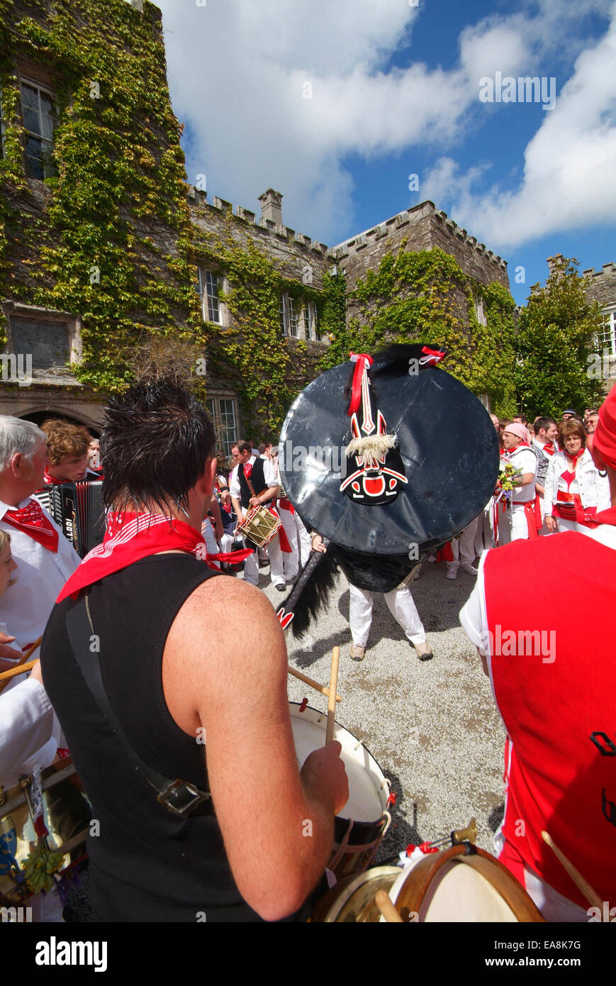 Close up of band red Oss & dancers outside Prideaux House Prideaux Place in Padstow on the first of may Obby Oss day North Cornw Stock Photo