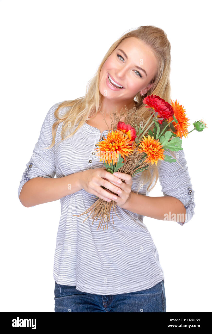 Happy woman with beautiful fresh autumn flowers isolated on white background, enjoying wonderful gift for Thanksgiving day Stock Photo
