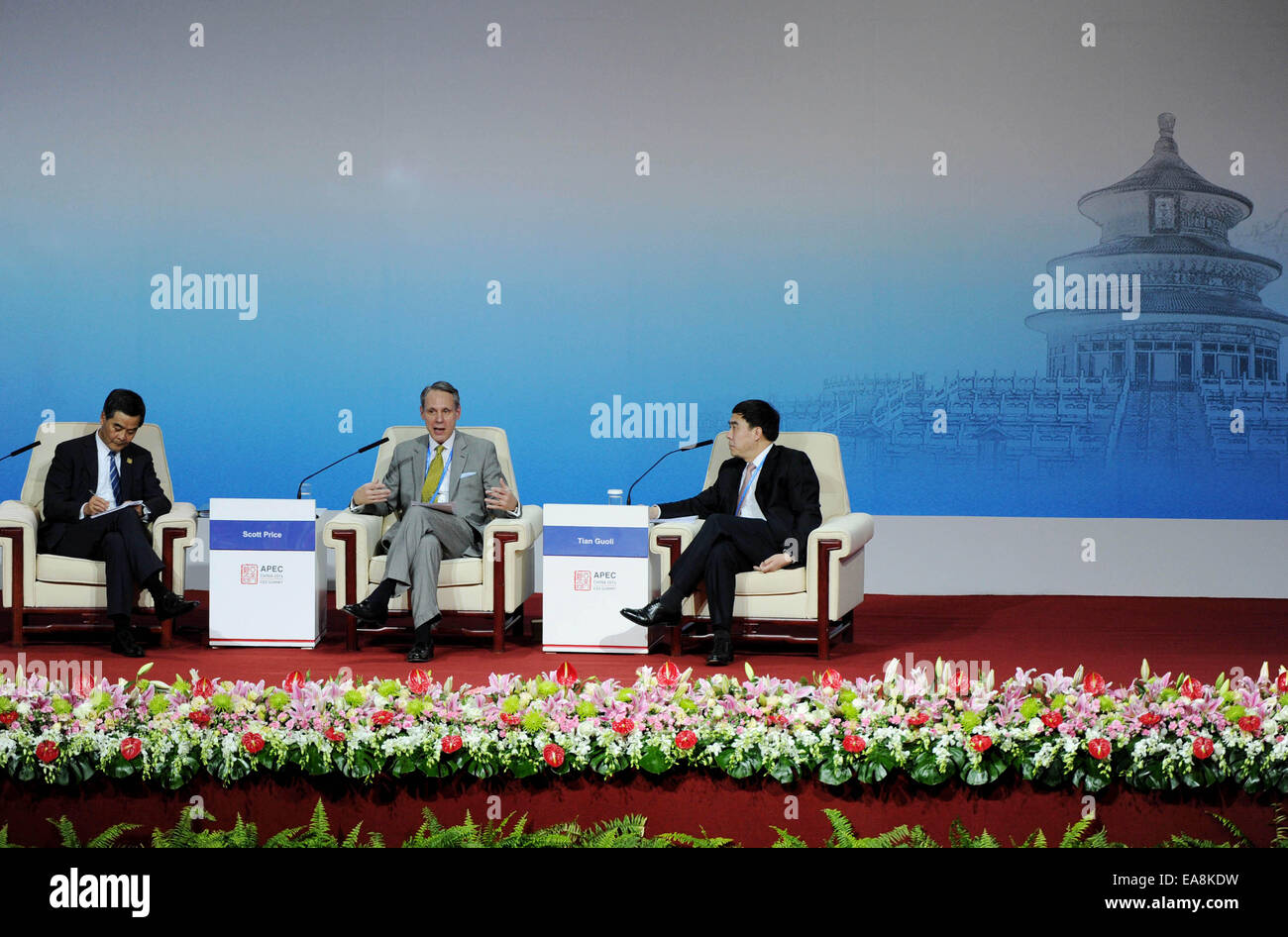Beijing, China. 9th Nov, 2014. Scott Price (C), Executive Vice President of Strategy and International Development of Walmart International, speaks in a summit review on the state of the global economy during the 2014 Asia-Pacific Economic Cooperation (APEC) CEO Summit in Beijing, capital of China, Nov. 9, 2014. The 2014 APEC CEO Summit opened in Beijing on Sunday. Credit:  Luo Xiaoguang/Xinhua/Alamy Live News Stock Photo