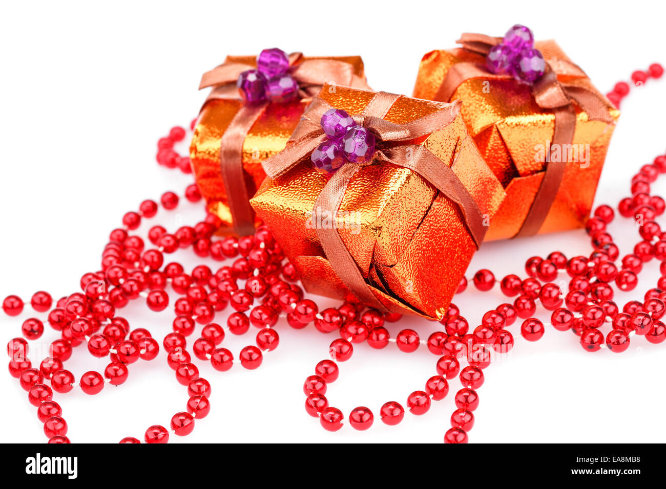Christmas boxes and beads isolated on white background Stock Photo Alamy
