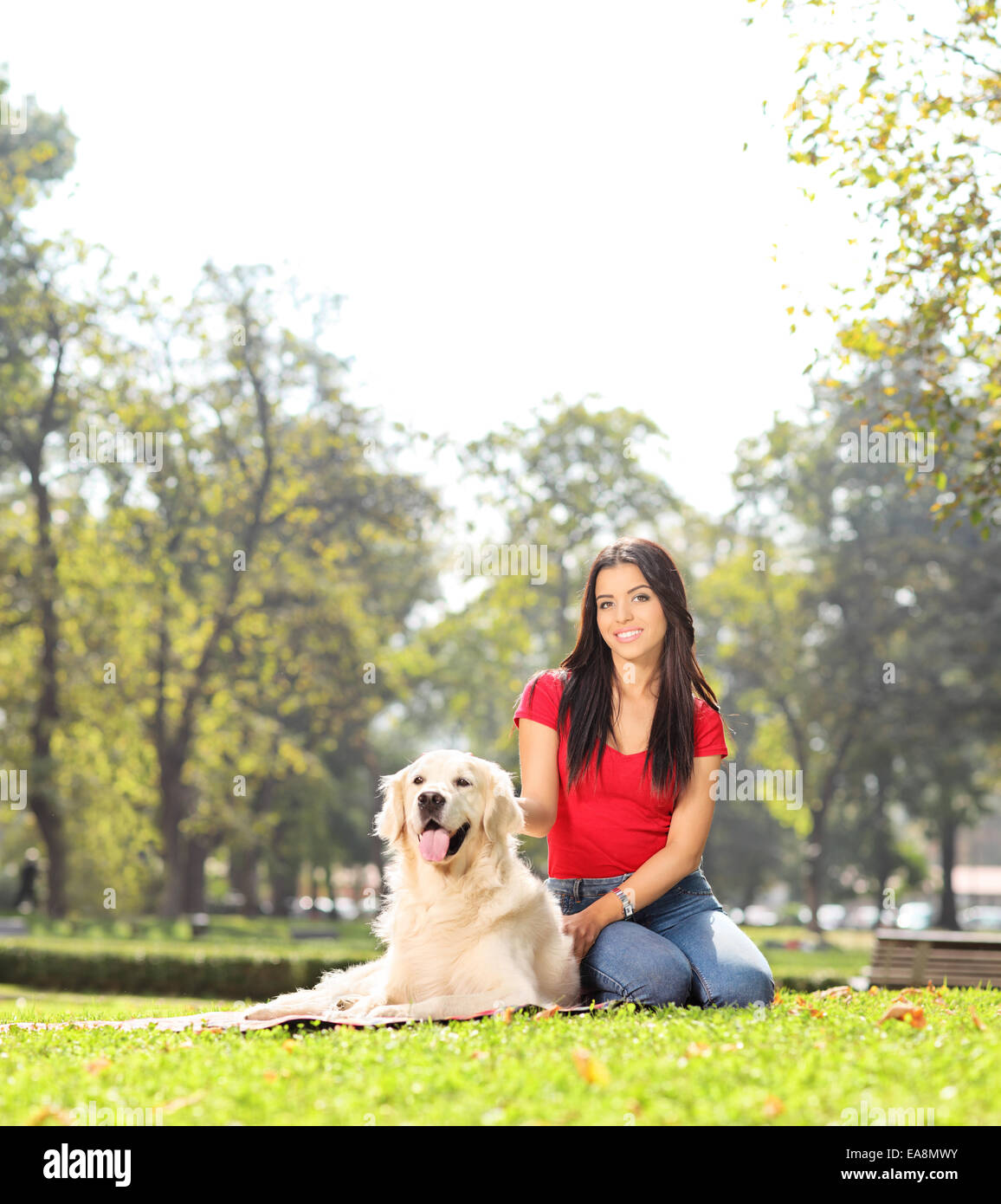 Girl sitting in park hi-res stock photography and images - Alamy