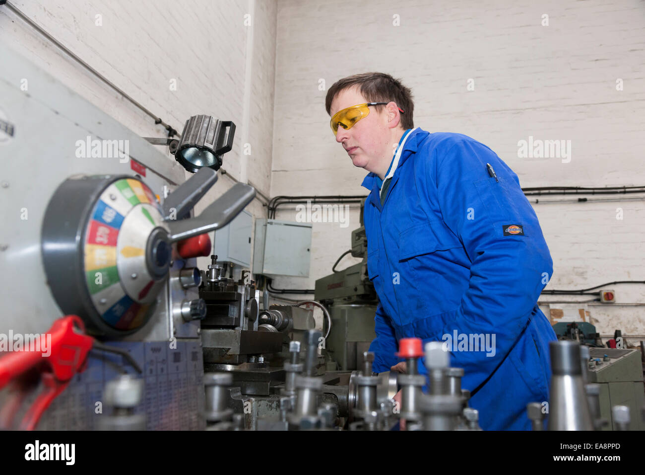 Engineer on a drilling machine tool used in the manufacture of