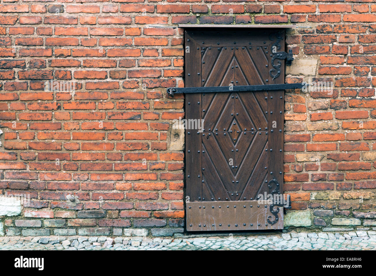 Wooden door in a brick wall Stock Photo Alamy