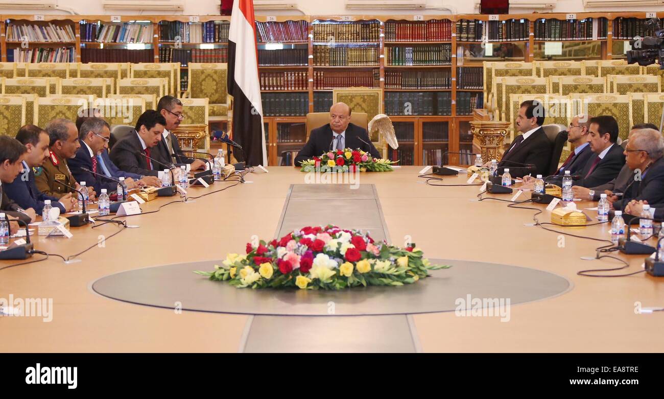 Sanaa. 9th Nov, 2014. Yemeni President AbdRabbu Mansour Hadi (C) holds