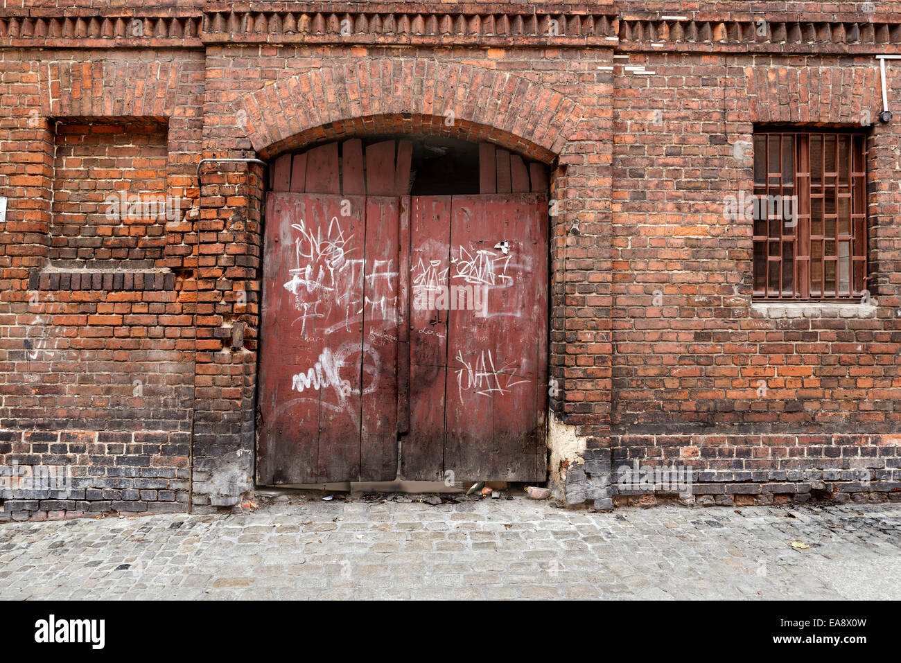 Old door in a brick wall Stock Photo Alamy