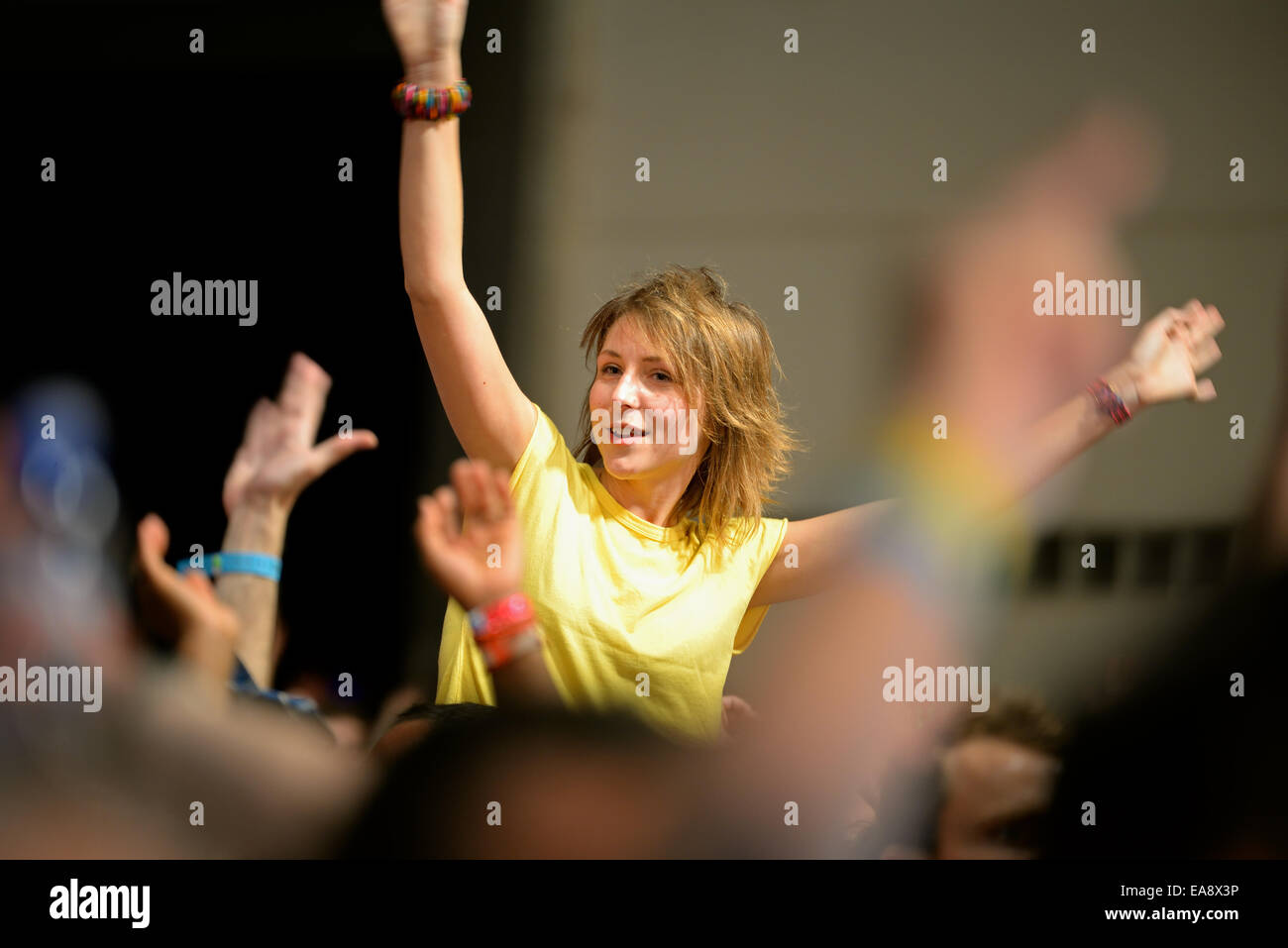 BARCELONA - JUN 14: A girl watches a concert at Sonar Festival on June 14, 2014 in Barcelona, Spain. Stock Photo