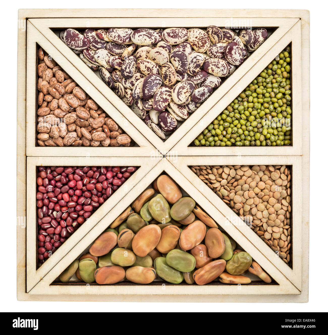 triangles and squares abstract  - a variety of beans and lentils in an isolated wooden tray Stock Photo