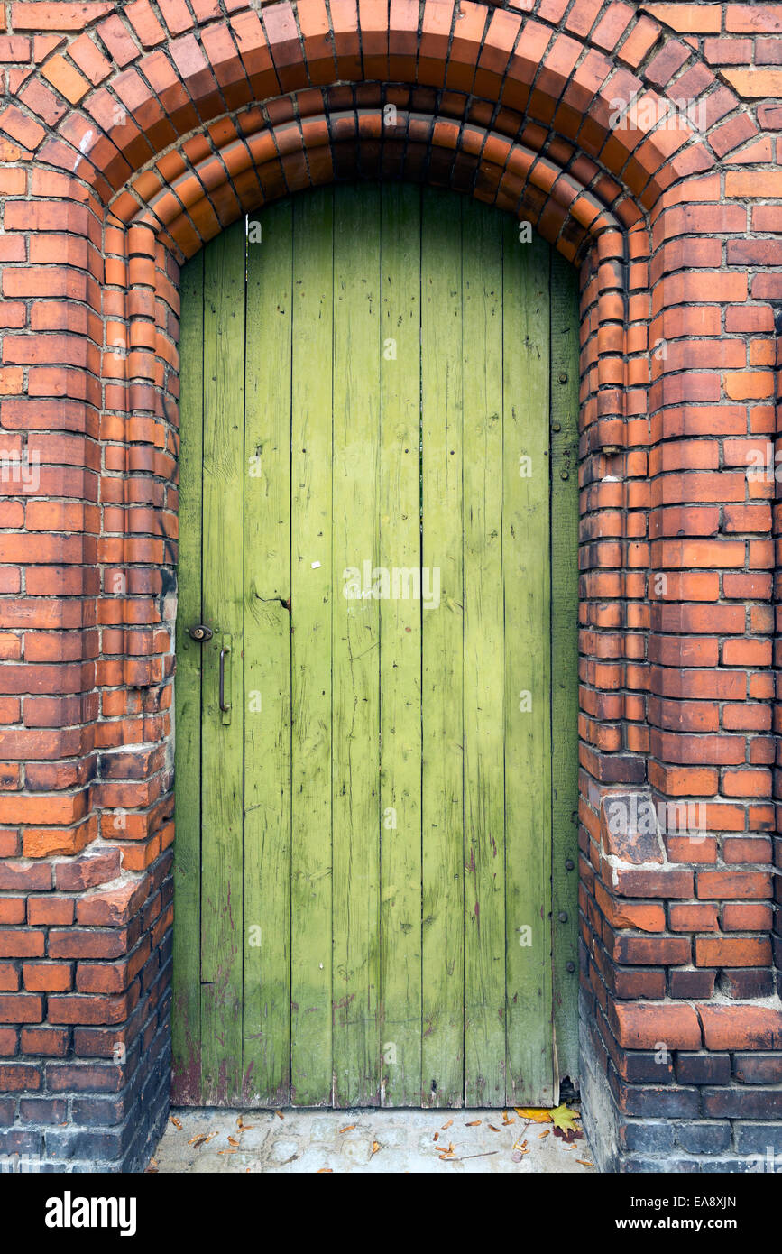 Old door in a brick wall Stock Photo Alamy
