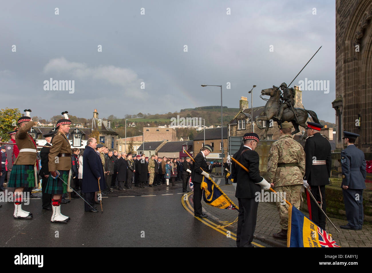 Galashiels, UK. 09 Nov 2014. Remembrance Day Parade Remembrance Sunday Ceremonies at the War Memorial in Galashiels. Standard dipped at the War Memorial during the Remembrance ceremony led by the Rev Duncan McCosh (St Peters Church) (Photo: Rob Gray) Stock Photo