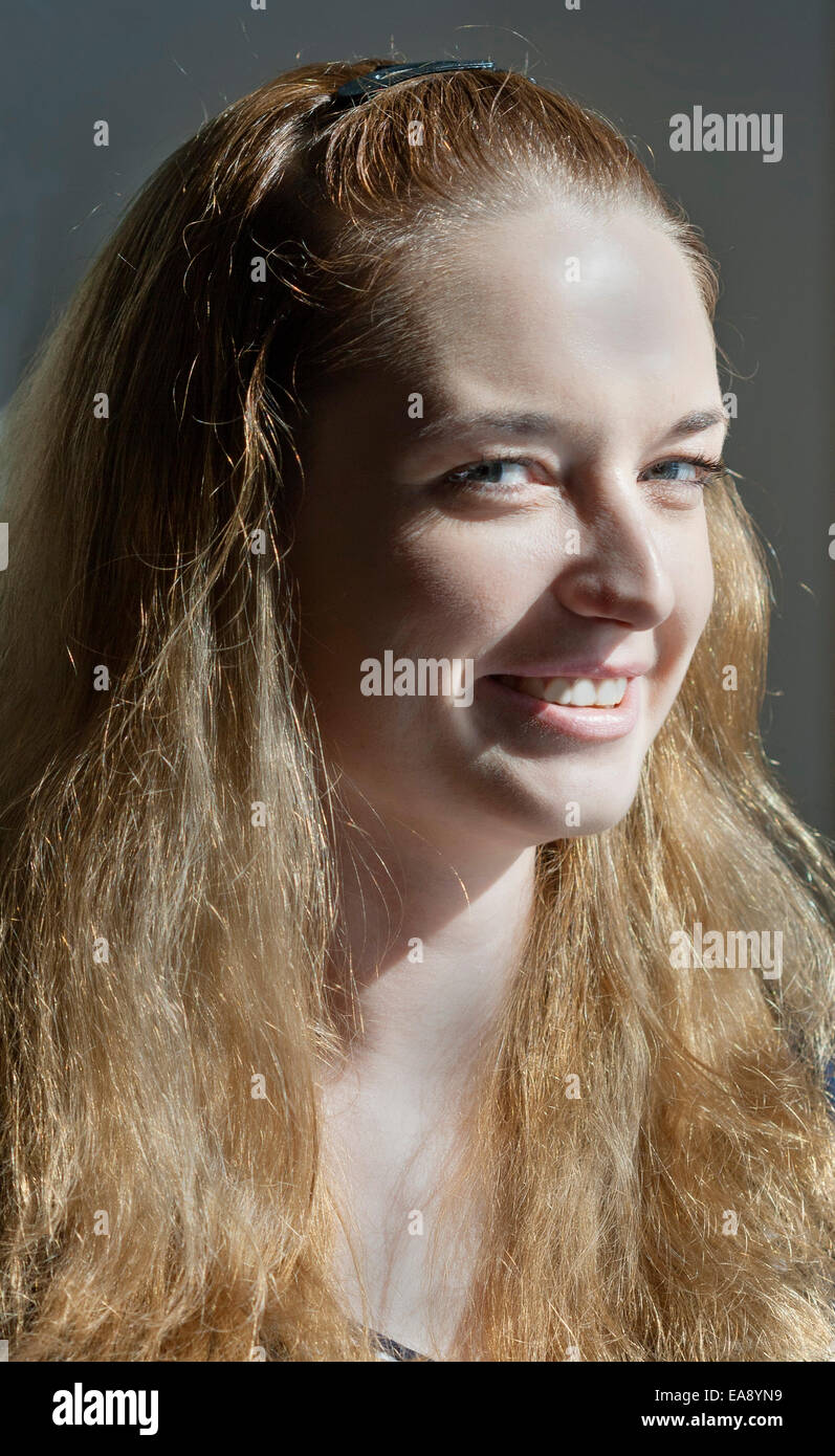 young attractive long blond hair woman looking at camera closeup Stock Photo