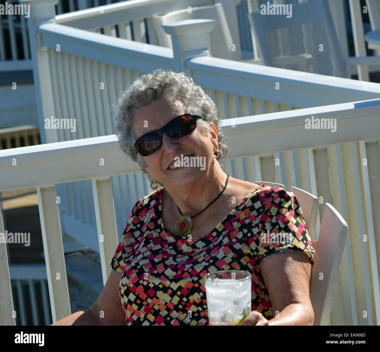 female, woman, senior citizen enjoying life at the beach, good lifestyle in the USA Stock Photo