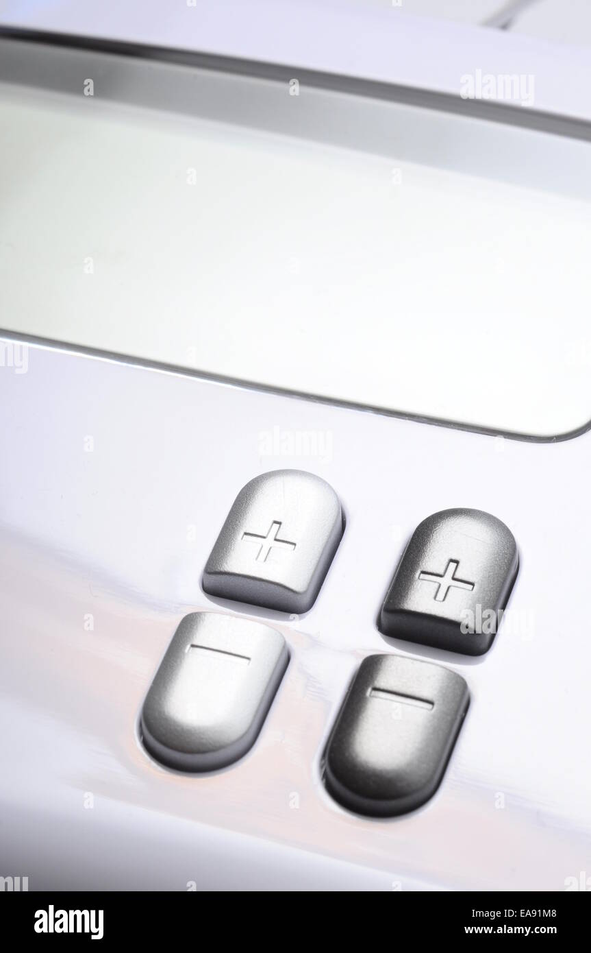 Close up of plus and minus buttons of a device Stock Photo