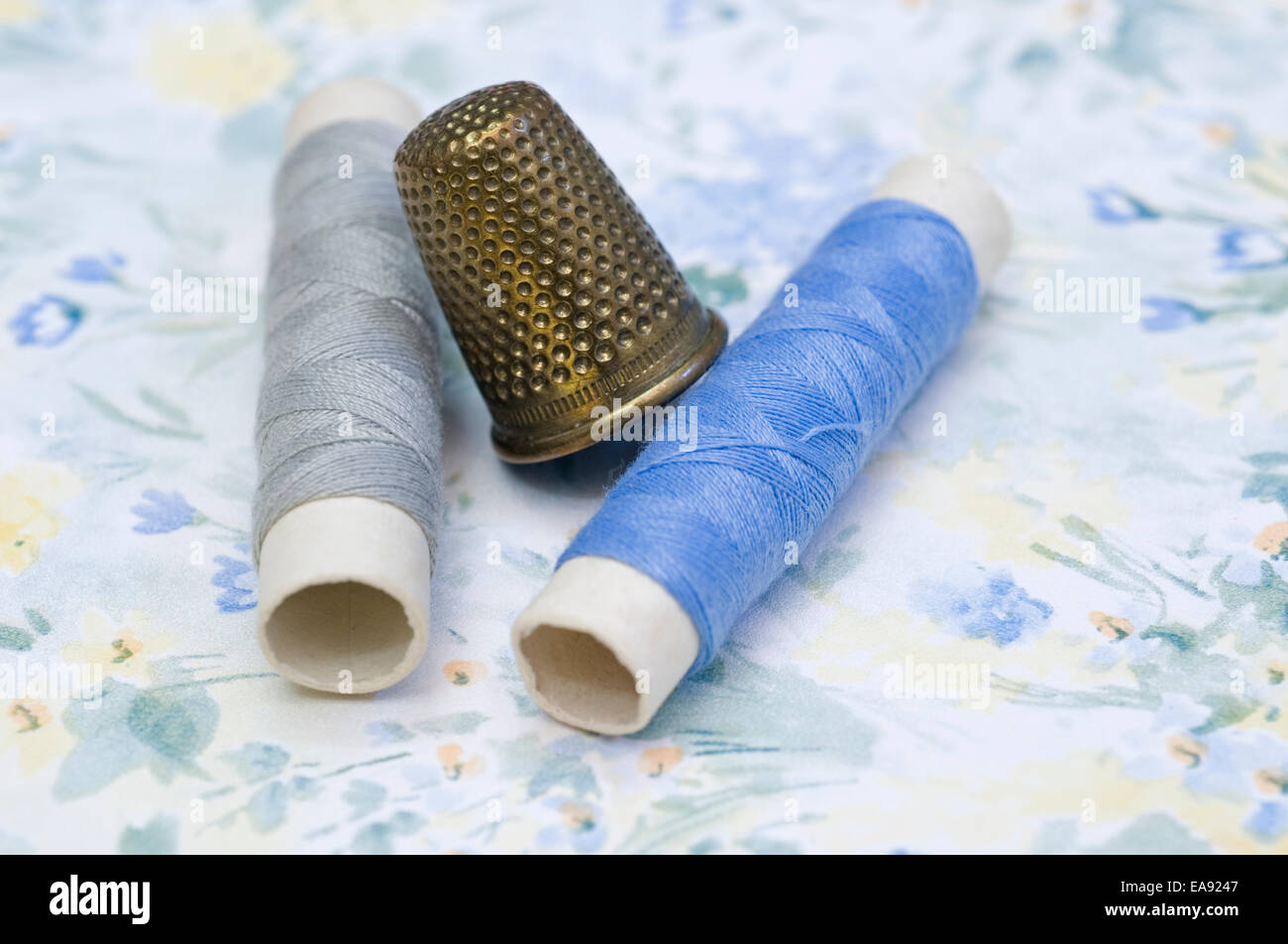 sewing thimble and spools Stock Photo