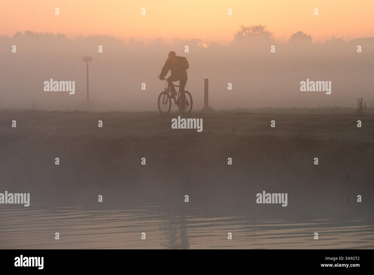 Cambridge University student rowers out on the River Cam at sunrise in