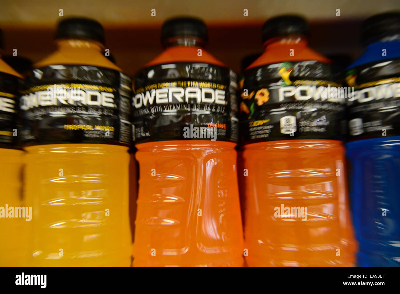 https://c8.alamy.com/comp/EA93EF/various-flavors-of-powerade-sports-drink-sit-on-a-shelf-in-a-store-EA93EF.jpg