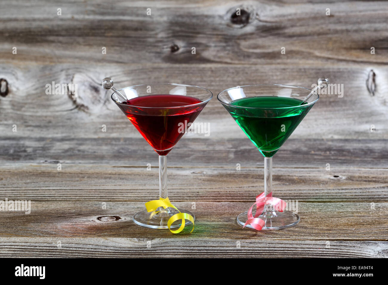 Horizontal image of colorful cocktail drinks on rustic wood with ribbons Stock Photo