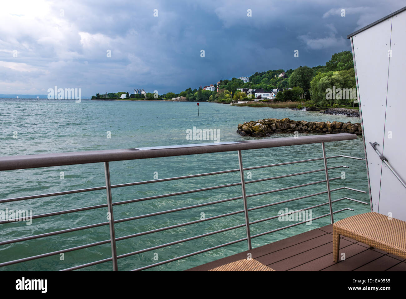 Lake Neuchatel seen from the private wharf of a luxury hotel room in a day of stormy weather Stock Photo