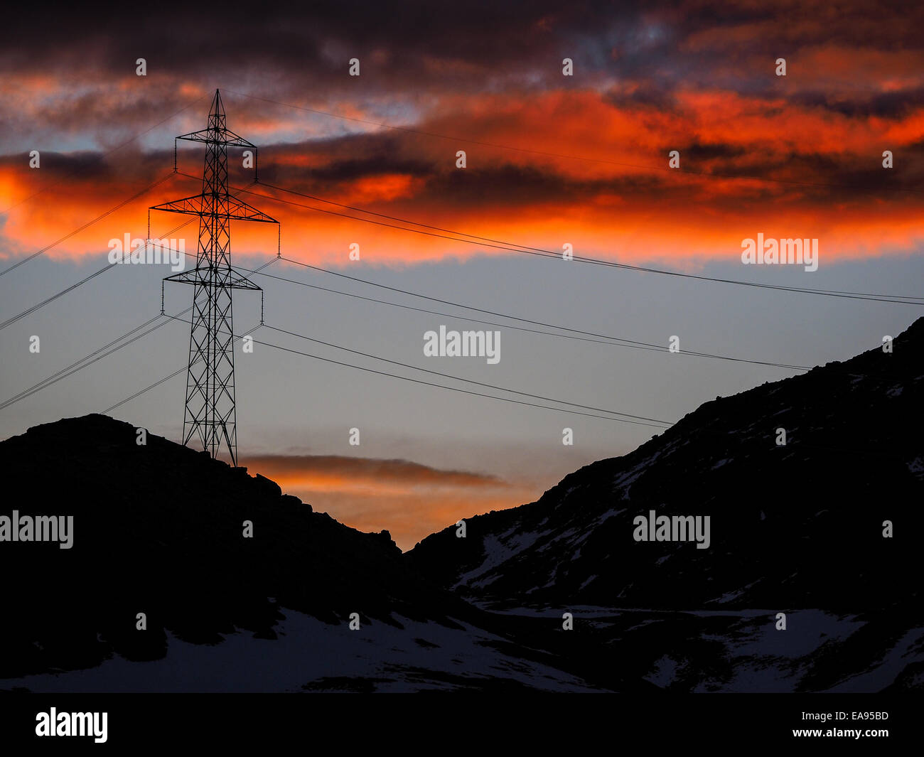 High voltage electric power line in the foreground in a majestic high ...