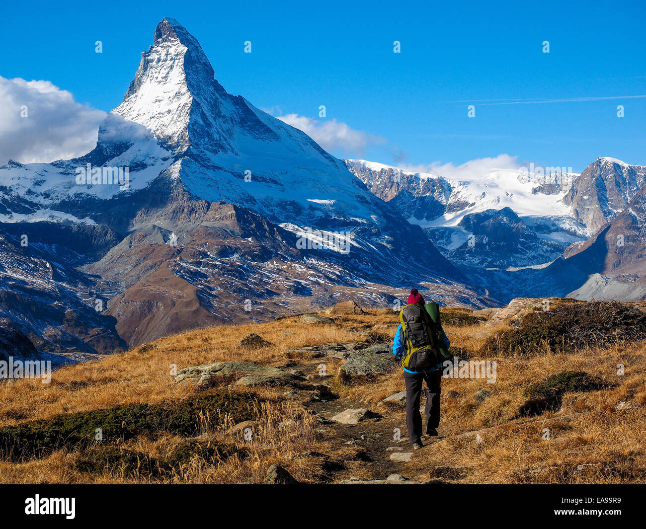 Matterhorn in early morning and trekker with outdoor equipment
