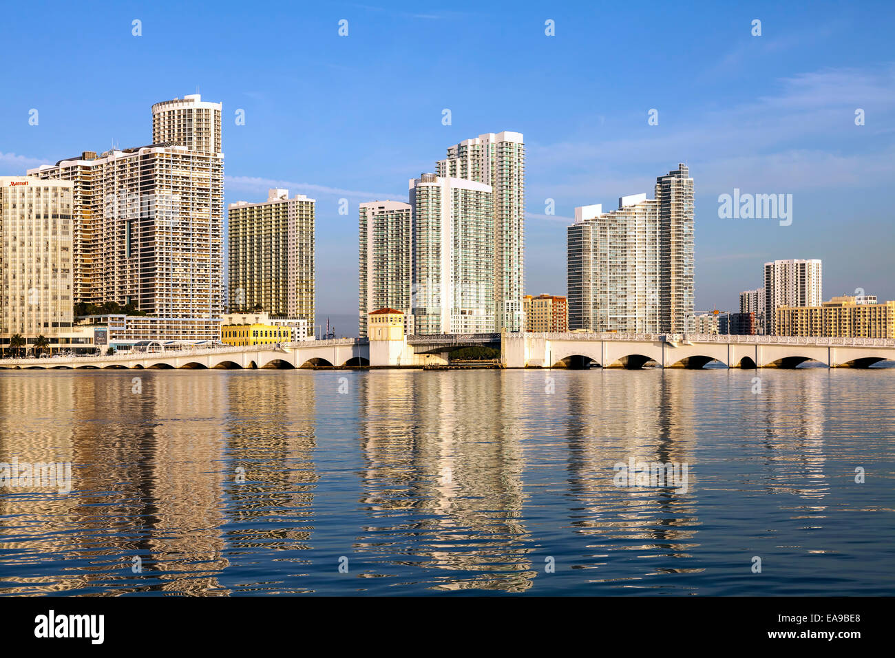 The historic Venetian Causeway bascule bridge arches it's way across Biscayne Bay with the Miami skyline beyond, Florida, USA. Stock Photo