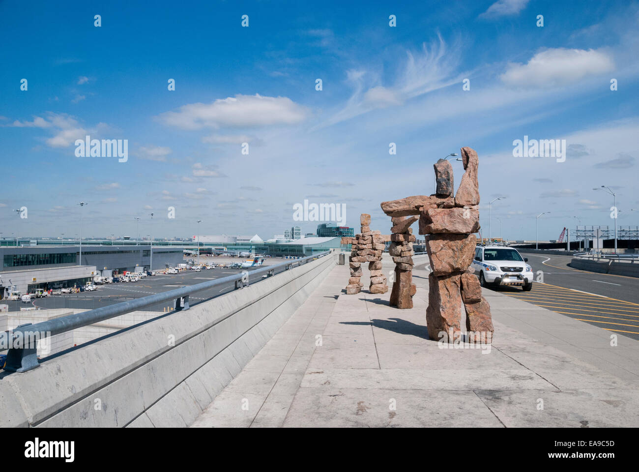 Three inukshuk posed to represent air marshalling signals decorate the entrance at Toronto's Pearson International Airport Stock Photo