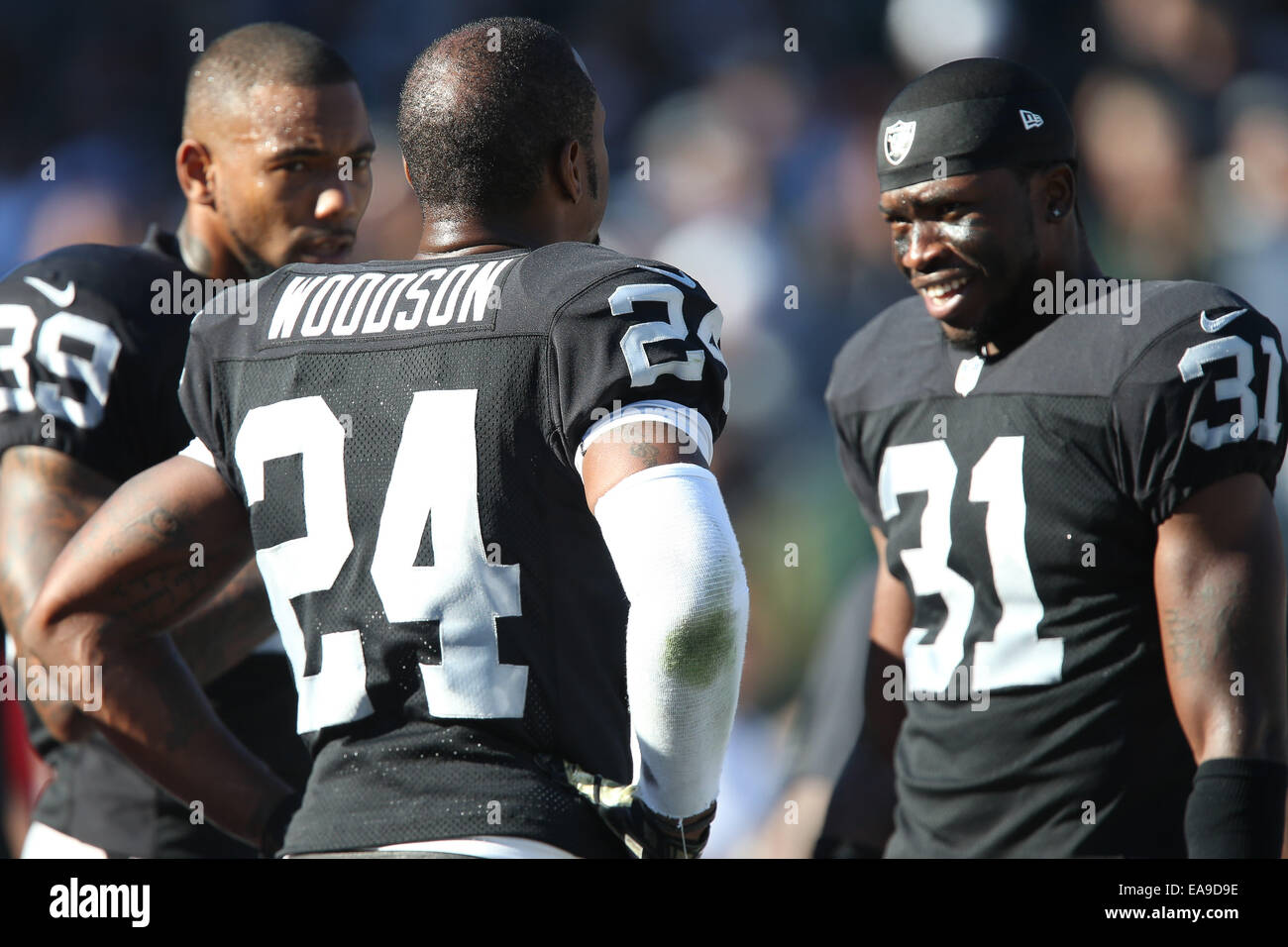 Oakland, California, USA. 15th Sep, 2013. Oakland Raiders free safety  Charles Woodson (24) tackles Jacksonville Jaguars tight end Clay Harbor  (86) on Sunday, September 15, 2013, in Oakland, California. The Raiders  defeated