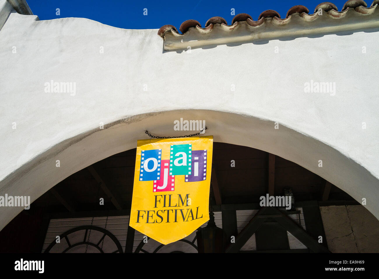 An Ojai film festival banner hangs from a stucco archway of the Mission
