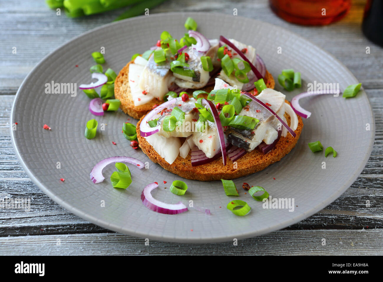 canapes with herring on a white plate, close up Stock Photo Alamy