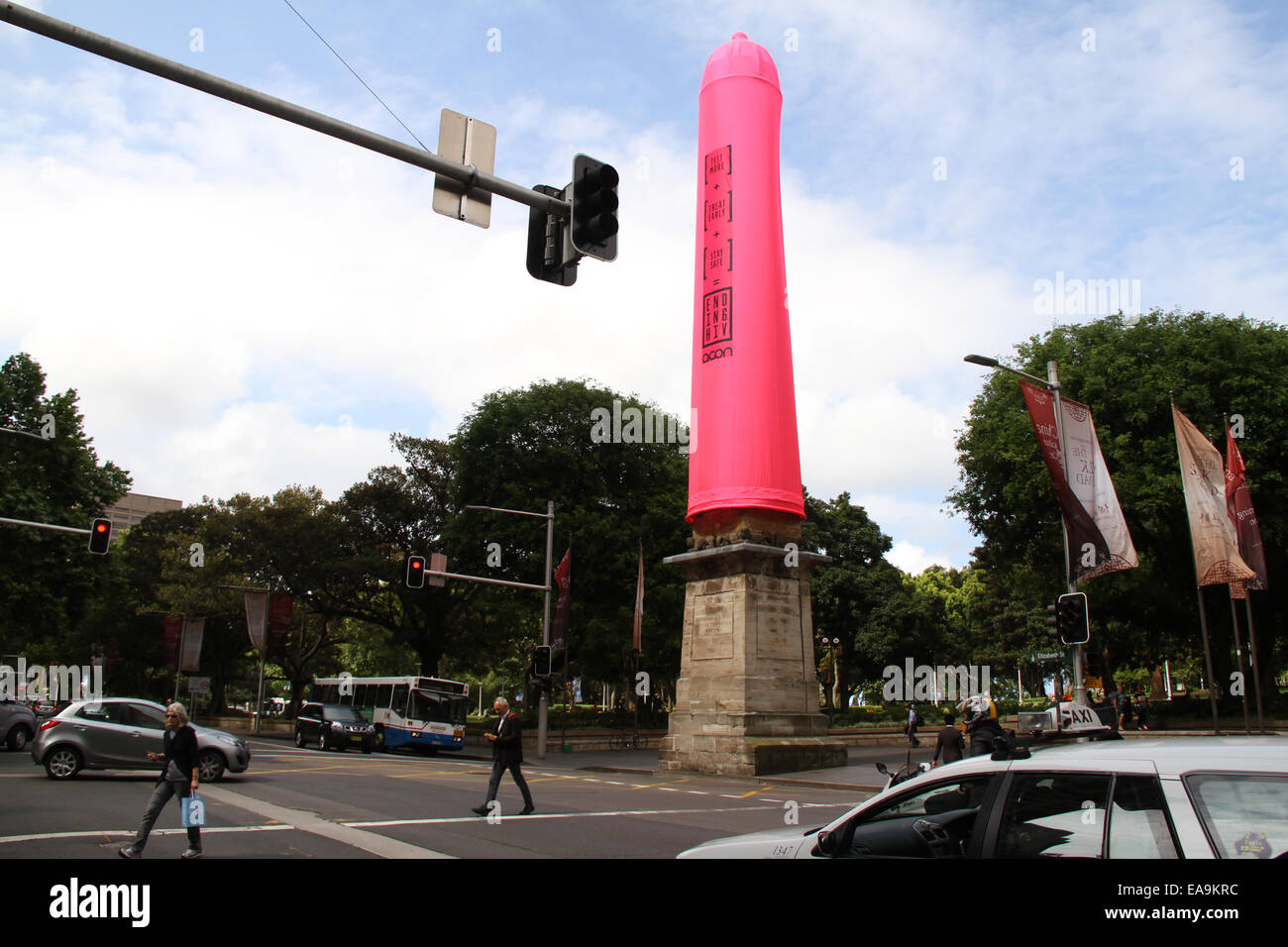Hyde Park South, Cnr Bathurst Street and Elizabeth Street, Sydney, NSW, Australia. 10th Nov, 2014.  An 18-metre high giant pink condom has been inserted onto the Obelisk at Hyde Park in Sydney to raise awareness of HIV issues. It is an initiative of the AIDS Council of NSW (ACON) in the lead up to World AIDS Day on 1 December. Copyright Credit:  2014 Richard Milnes/Alamy Live News. Stock Photo