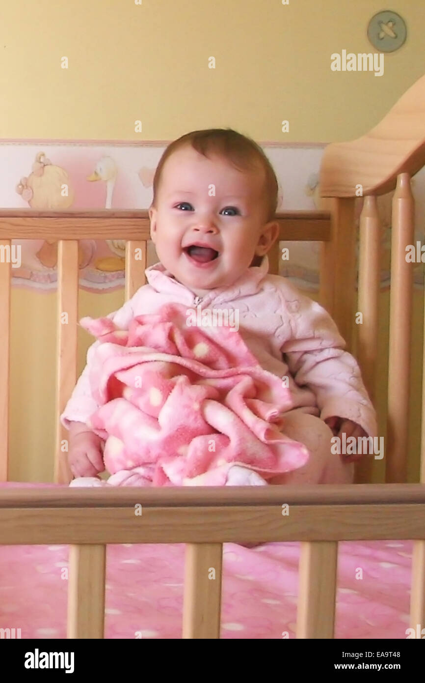 Little Baby Girls In Crib Together Triplets Stock Photo