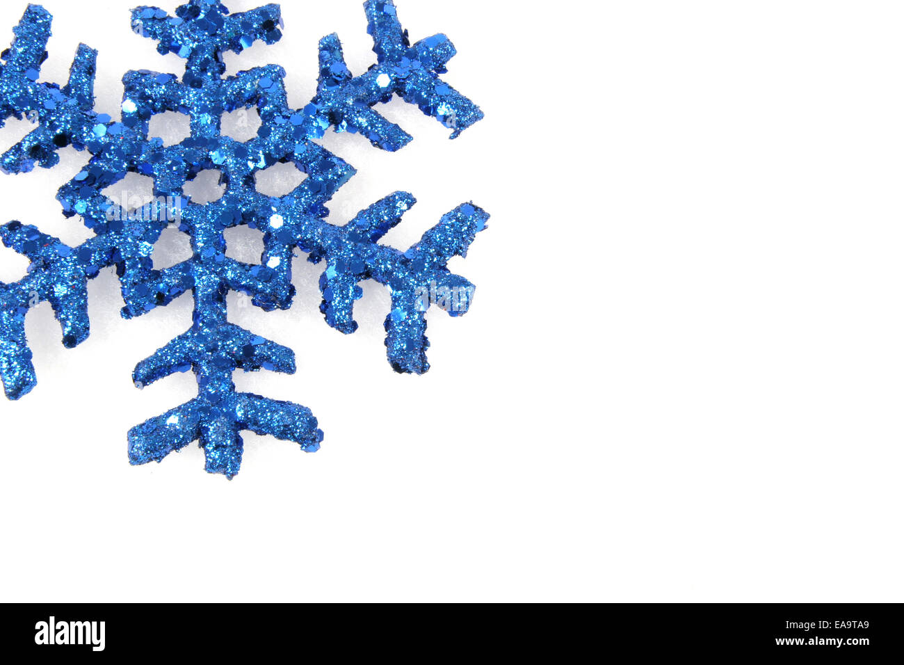 Blue snowflake on isolated white background Stock Photo - Alamy