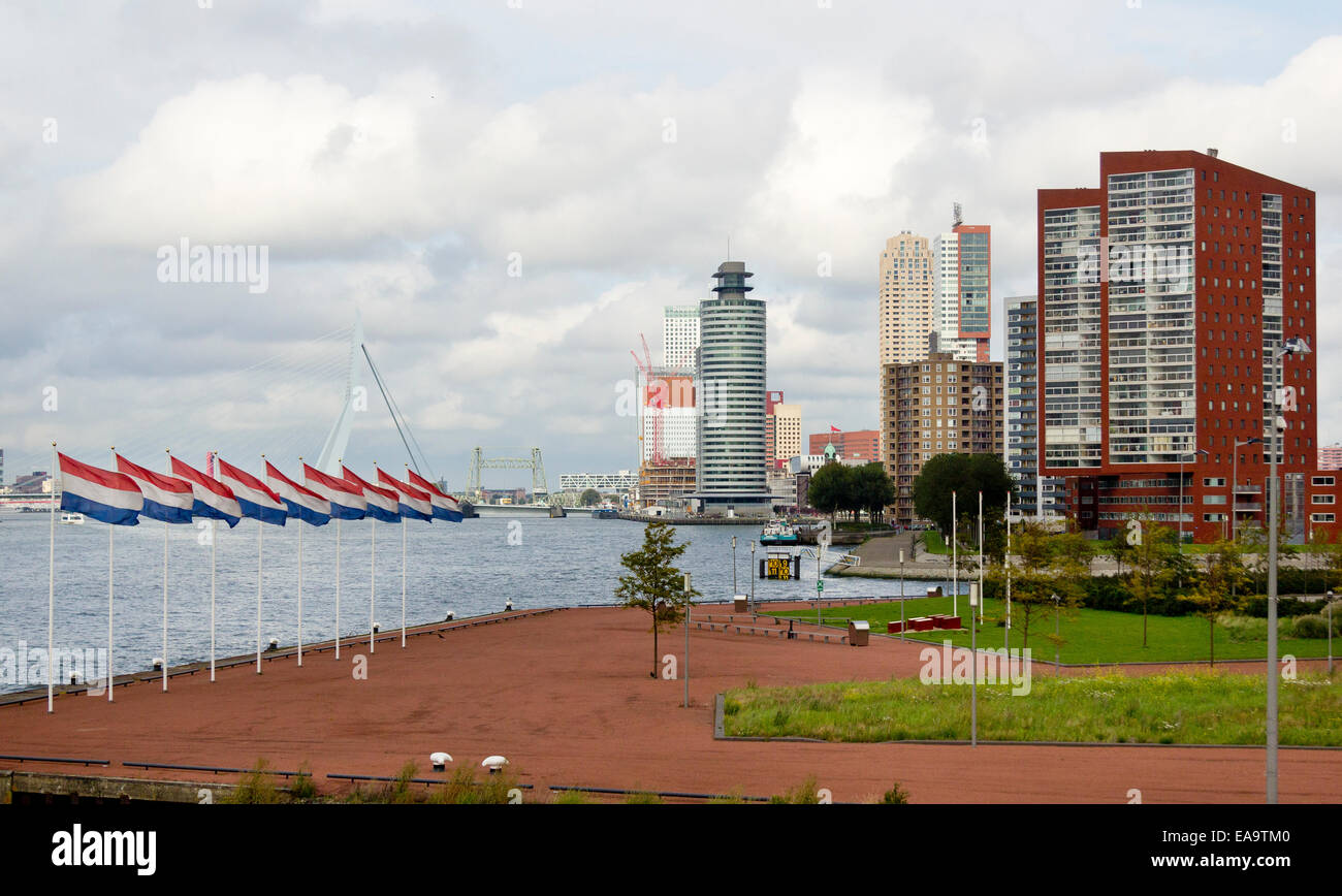 Dutch flags flying in the Katendrecht, district besides the River Nieuwe Maas, in Rotterdam. Kop van Zuid in background. Stock Photo
