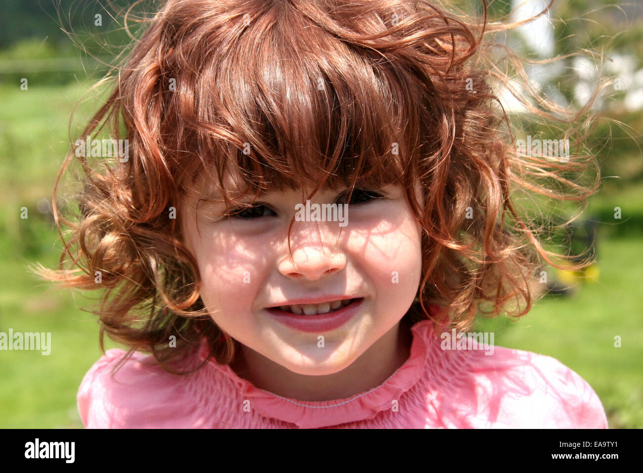 Little Girl in pink dress taken closeup Stock Photo - Alamy