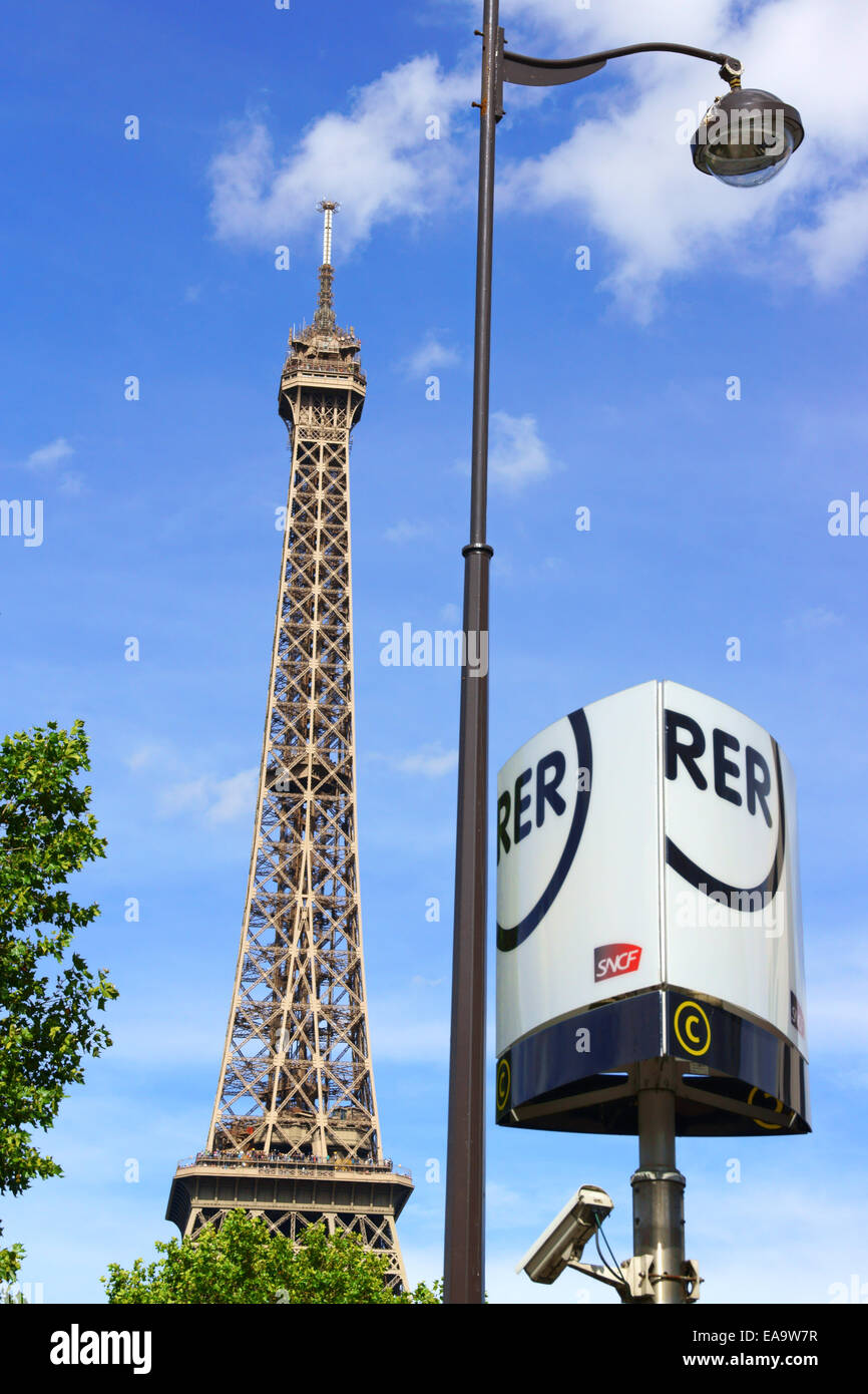 Paris, France - August 17, 2013: the Eiffel Tower (Tour Eiffel) and RER sign on a cloudy summer day in Paris, France. Stock Photo