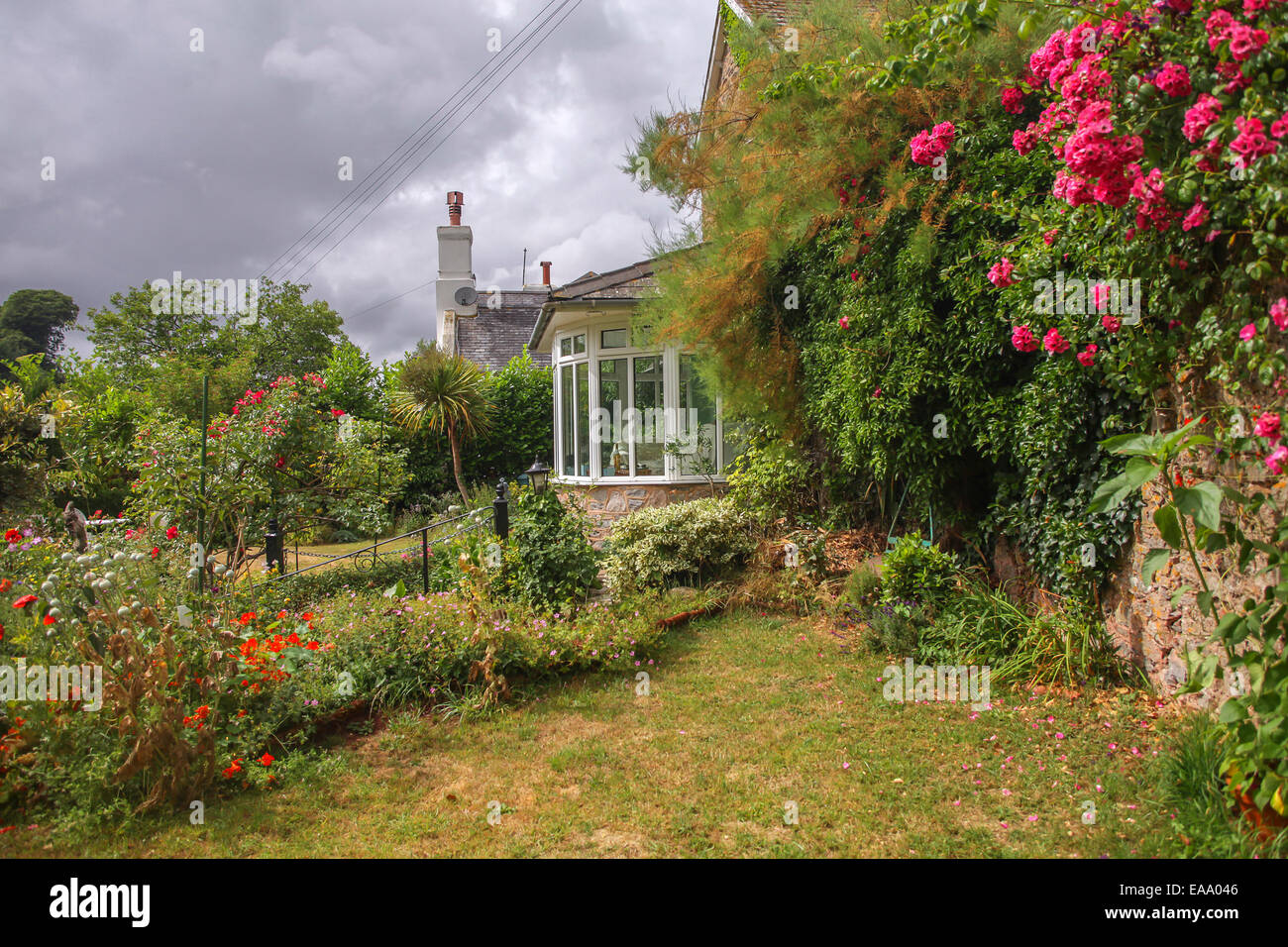 Cottage With Rose Garden In A British Village Stock Photo