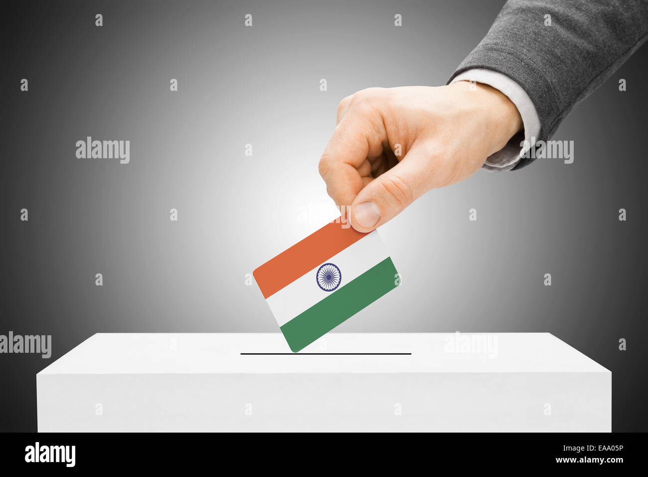 Voting concept - Male inserting flag into ballot box - India Stock ...