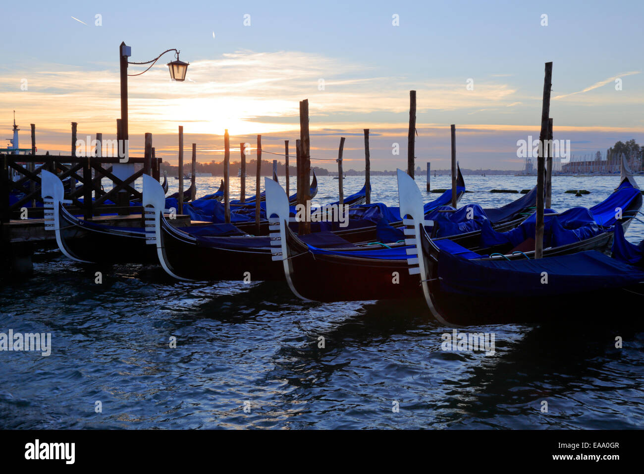 Gondolas at sunrise on St Mark's waterfront, Venice, Italy Stock Photo ...
