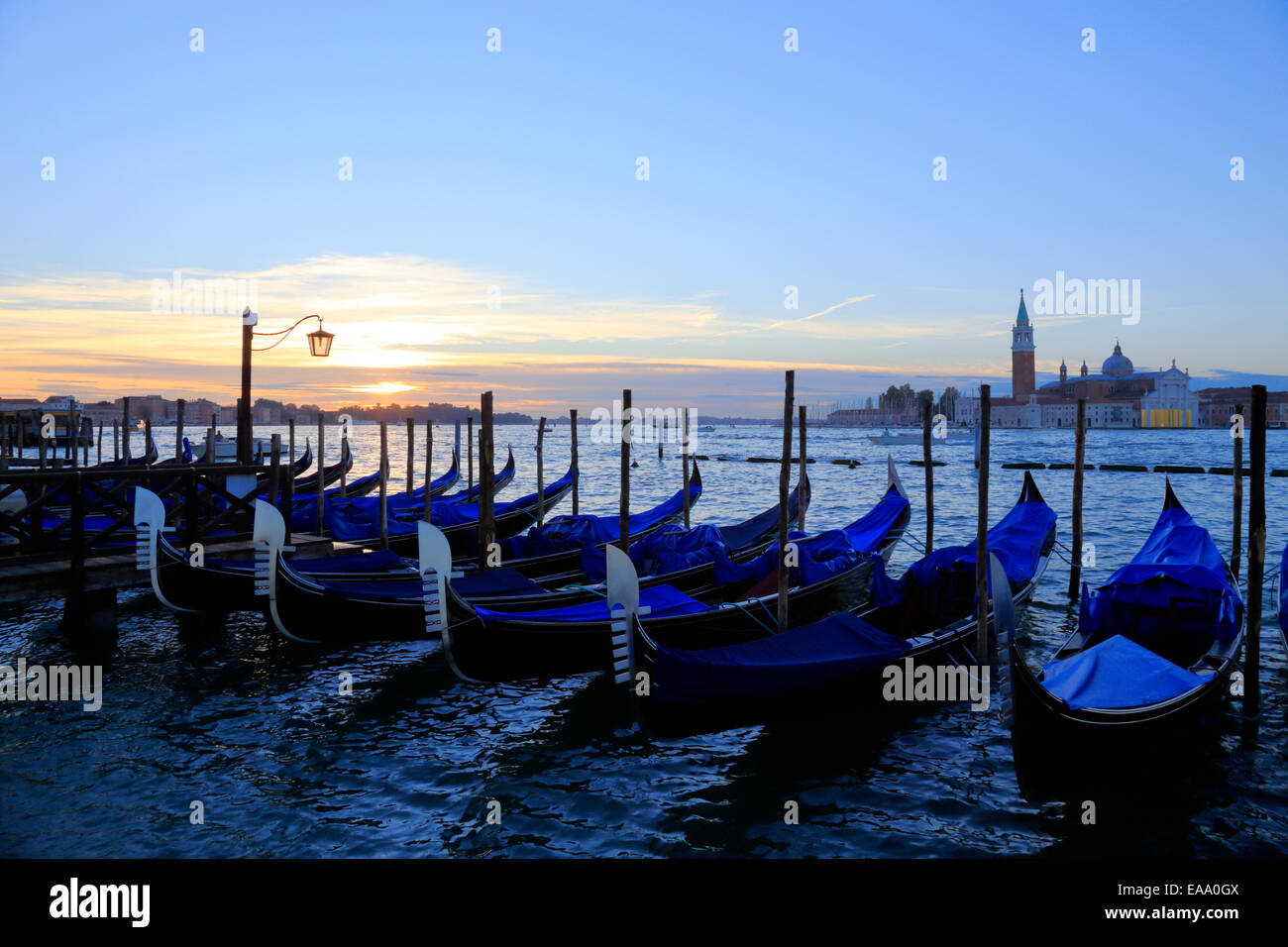 Gondolas at sunrise on St Mark's waterfront, Venice, Italy Stock Photo ...