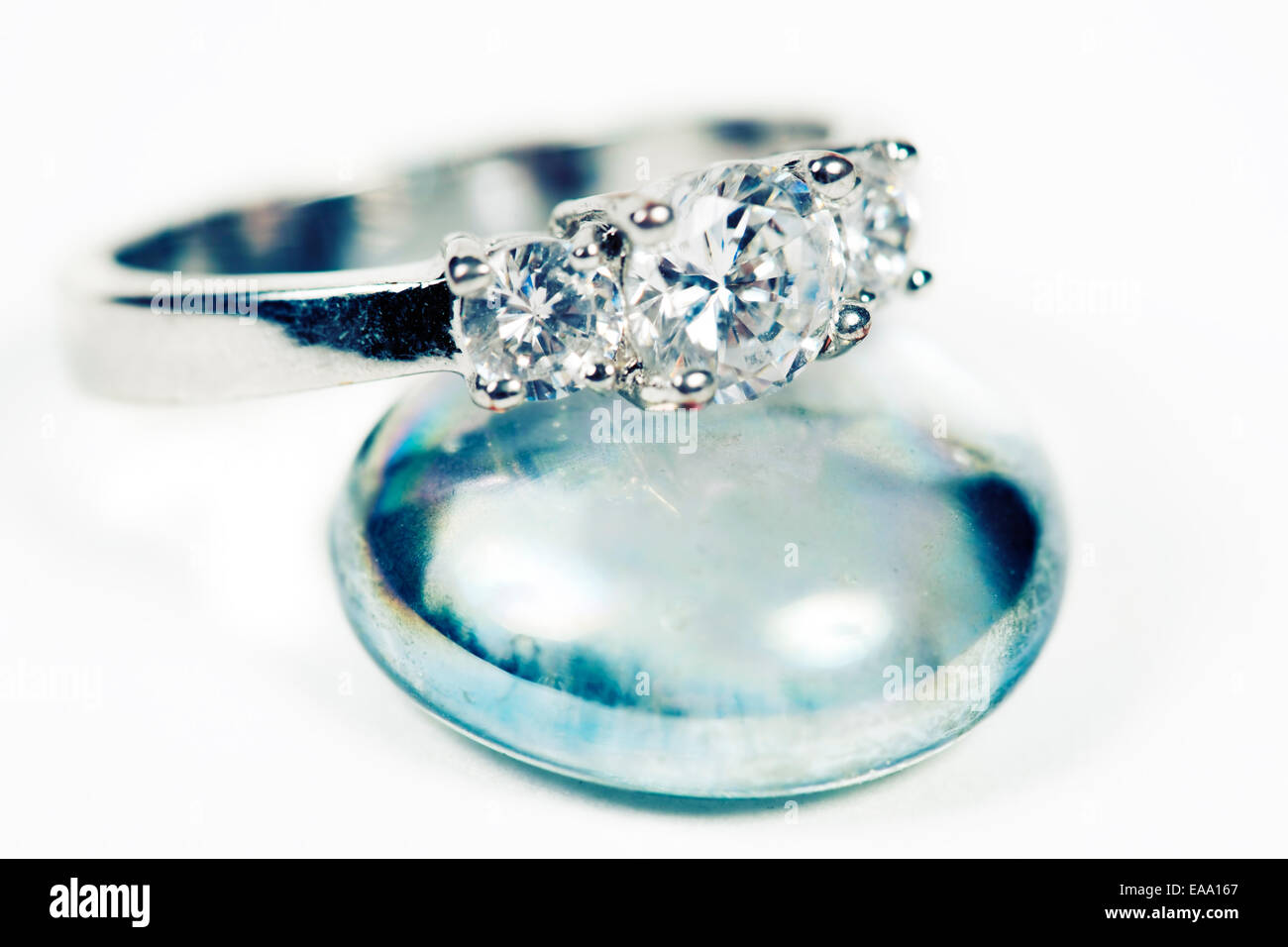 Engagement Ring taken closeup on glass pebble Stock Photo Alamy