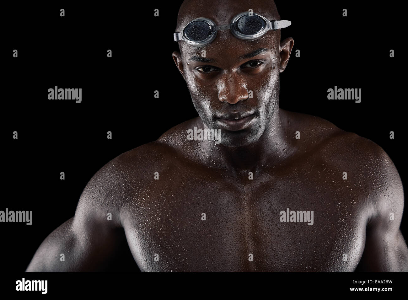 Studio shot of a handsome swimmer against a black background Stock Photo
