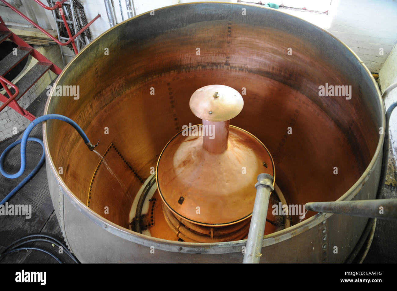Copper tank used in the brewing process at a brewery in England Stock