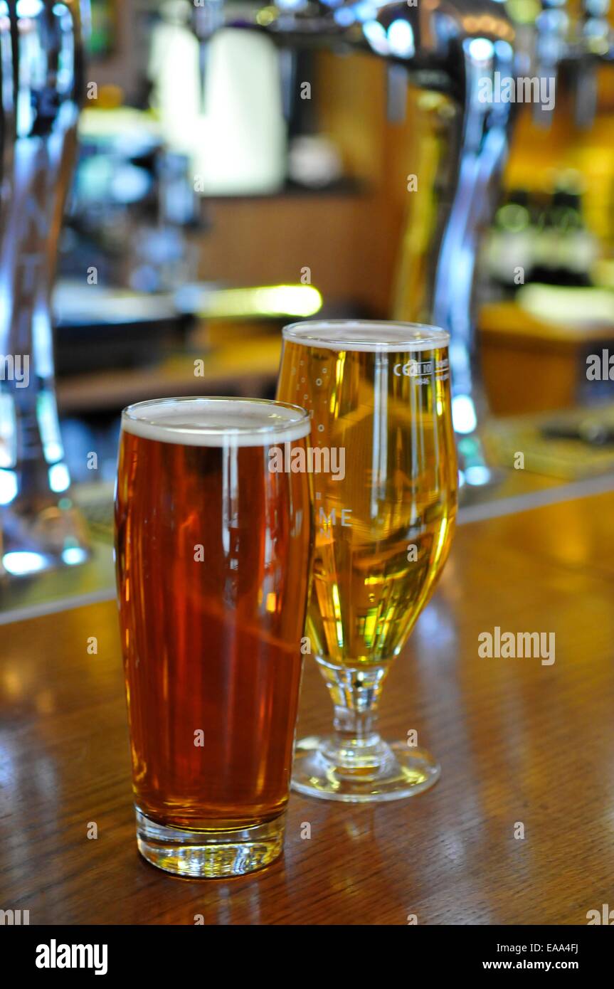 Pints of beer on a bar in a pub in Greenwich, London Stock Photo