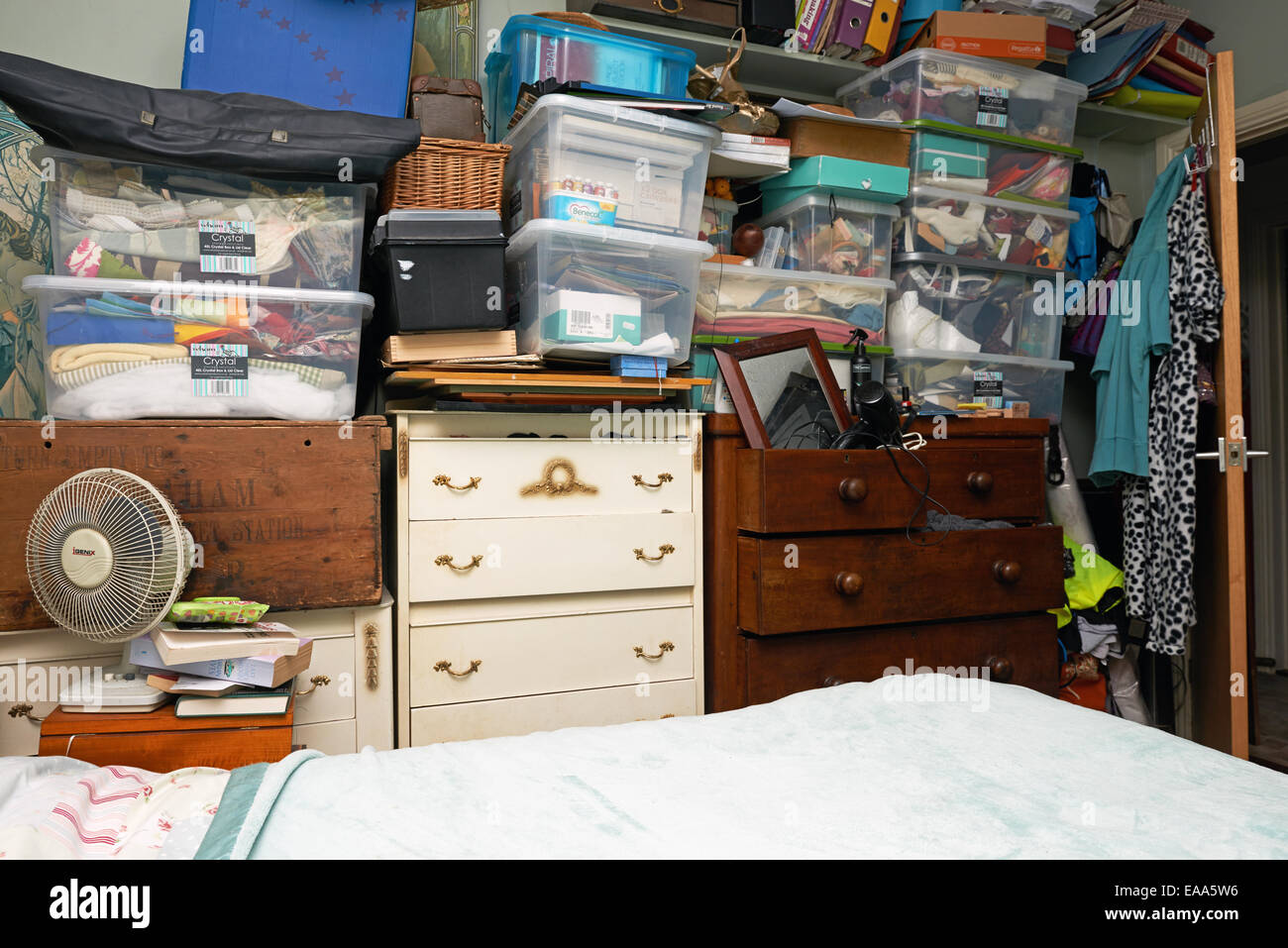 Bedroom filled with clutter Stock Photo